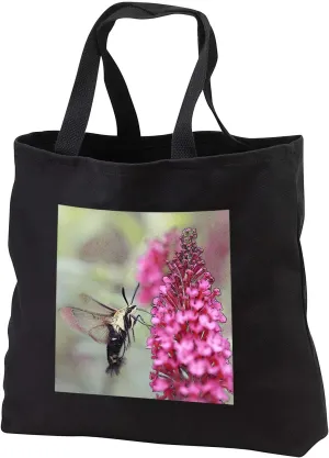 3dRose Abstract photograph of a hummingbird moth pollinating a butterfly... - Tote Bags (tb_337795)